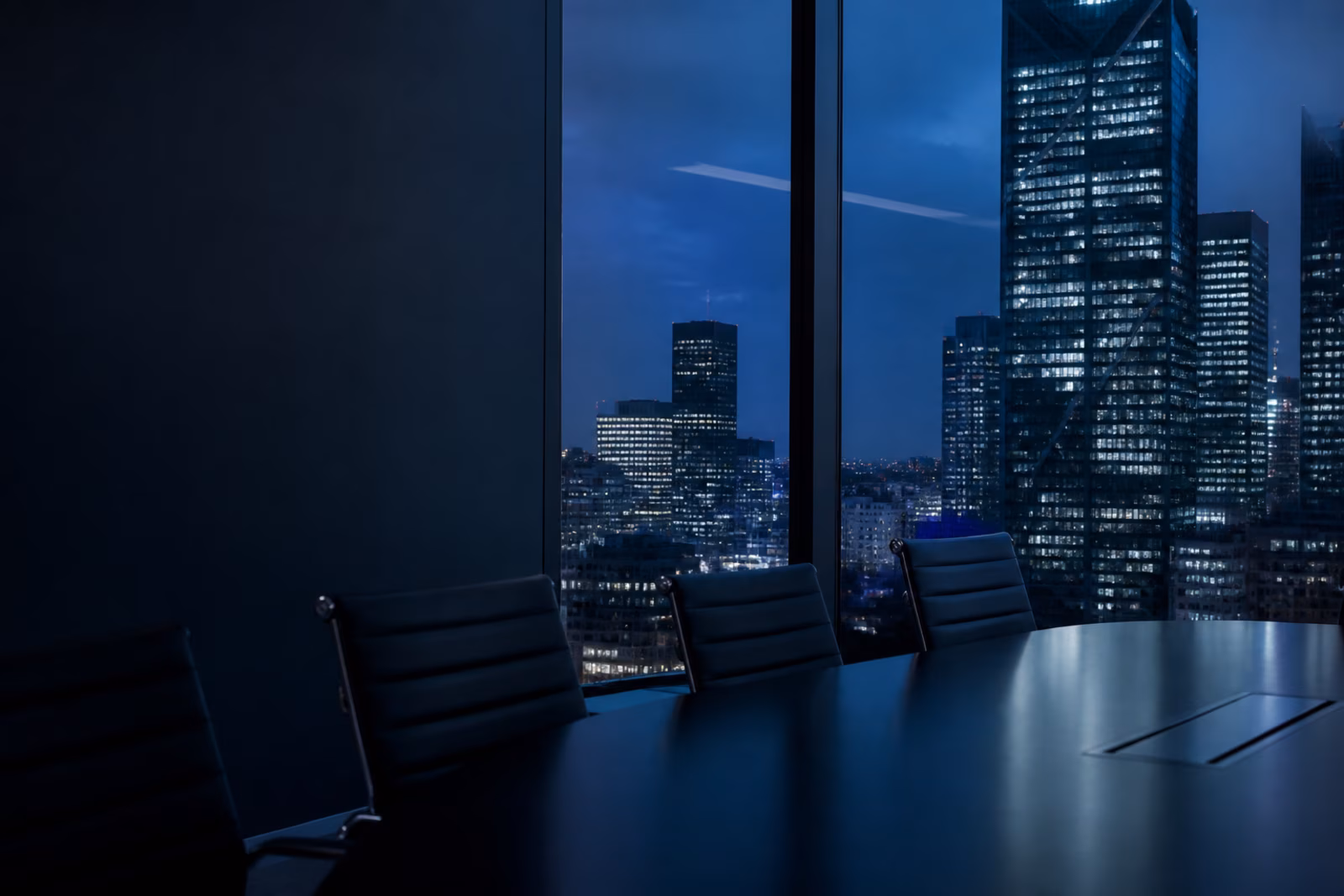 A quiet executive working room overlooking a city at night